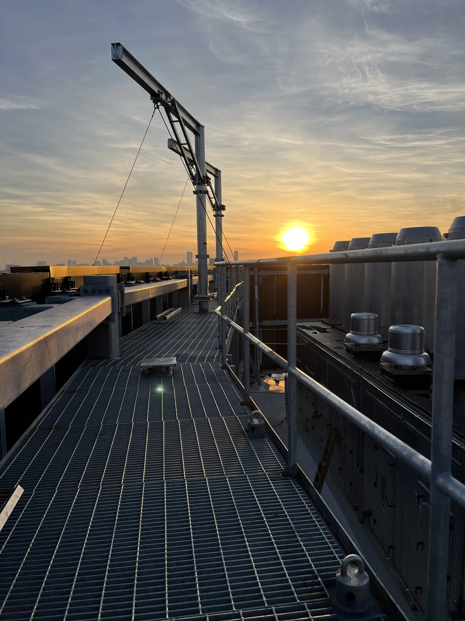 Rooftop davit system at sunset