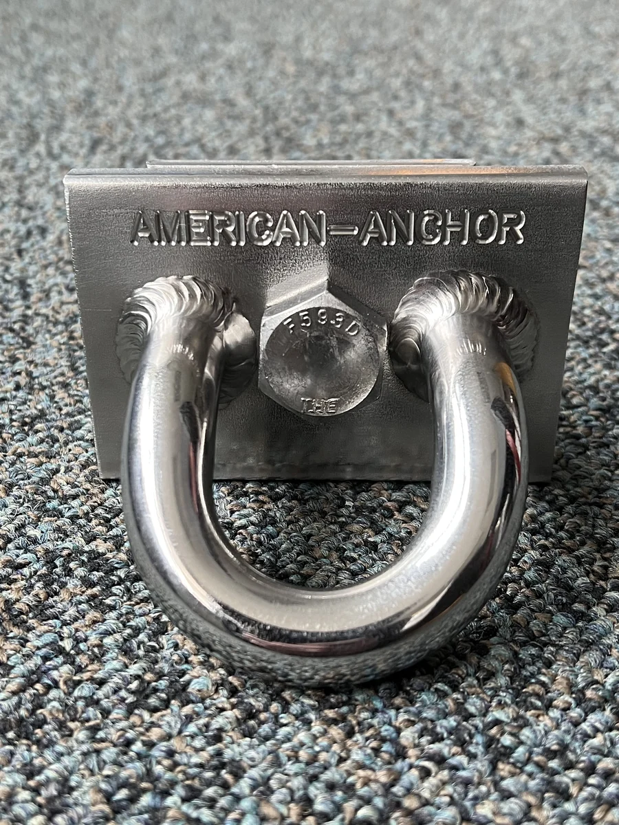 American Anchor stainless roof anchor with the company name cast into the base plate